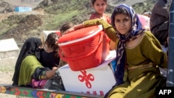 Afghan refugees deported from Pakistan arrive with their belongings at a makeshift camp near the Afghanistan-Pakistan border in Torkham, Nangarhar Province, on April 7.