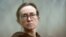 RFE/RL journalist Alsu Kurmasheva stands in a glass cage in a courtroom in Kazan, Russia, on February 1. She has been detained since October 2023. 