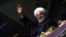 Iranian President Hassan Rohani greets supporters during a campaign rally in Hamedan on May 8.