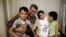 Nasrin Sotoudeh (second from right) poses with her husband, Reza Khandan, her son Nima, and her daughter Mehraveh at her house in Tehran in September 2013.