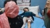 A injured girl who lives in a village near the Line of Control between India and Pakistan receives treatment at a hospital in Indian-controlled Kashmir following shelling by Pakistani forces on May 7. 