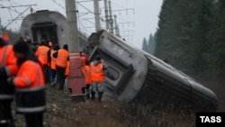 Work crews clean up at the site of the bomb attack in November 2009 on the "Nevsky Express" train route, which killed 27 people and injured many more.