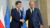Polish Prime Minister Donald Tusk (right) meets with Romanian President-elect Nicusor Dan in Warsaw on May 25. 