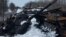 UKRAINE – A charred Russian tank and captured tanks are seen, amid Russia's invasion of Ukraine, in the Sumy region, Ukraine, March 7, 2022. Picture taken March 7, 2022
