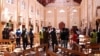 Sri Lankan security personnel walk through debris following an explosion in St Sebastian's Church in Negombo, north of the capital Colombo on April 21.