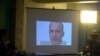 Pakistani journalists watch a video showing Indian national Kulbushan Jadhav in 2016.
