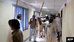 Pakistani opposition protesters shout anti-anti government slogans after storming the headquarters of the state owned Pakistan Television building during anti-government protests in Islamabad, September 1, 2014.