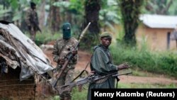 Vojnici Demokratske Republike Kongo (FARDC) u patroli protiv pobunjenika Savezničkih demokratskih snaga (ADF) i Nacionalne armije za oslobođenje Ugande (NALU) u blizini Benija, u provinciji Severni Kivu, 31. decembar 2013.