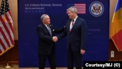 Ambasadorul american Adrian Zuckerman și ministrul Cătălin Predoiu