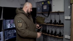 Taping Windows, Storing Water, Kyiv Residents Prepare For A Possible Russian Attack