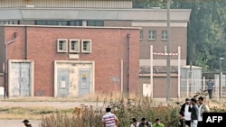 Франциянын Кале шаарындагы ооган мигранттары. Сентябрь, 2009-ж.