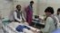 A wounded men receives treatment in a hospital after a suicide attack on the outskirts of Jalalabad city east of Kabul, on June 13.