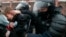 RUSSIA -- Police officers detain a young demonstrator during a protest near the Matrosskaya Tishina prison where Alexei Navalny is being held, in Moscow, Russia, on Sunday, Jan. 31, 2021.