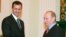 Russian President Vladimir Putin's reported buildup in Syria may be a move to maintain a foothold in that country -- and try to secure a strong say in what comes next -- in the event that President Bashar al-Assad (seen here with Putin in 2006) is ousted.