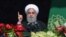 Iranian President Hassan Rohani delivers a speech during a rally marking the 39th anniversary of the 1979 Islamic Revolution in Tehran on February 11.