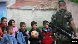 Kosovo - A French KFOR peacekeeper patrols the Albanian dominated southern part of the ethnic divided Kosovo town of Mitrovica, 25Apr2007