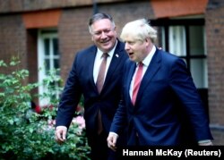 Secretarul de stat Mike Pompeo, alături de premierul Boris Johnson