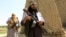 FILE: Taliban fighters in Afghanistan (June 2018).