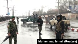 Afghan soldiers guard the site of an attack near the Marshal Fahim Military Academy in Kabul on January 29.