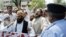 Demonstrators shout antigovernment slogans in Islamabad on July 13