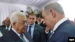 Mahmud Abas i Benjamin Netanjahu na sahrani Šimona Peresa u Jerusalimu u septembru 2016.
