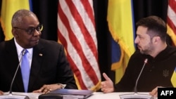 U.S. Secretary of Defense Lloyd Austin (left) and Ukrainian President Volodymyr Zelenskiy attend a previous meeting of the Ukraine Defense Contact Group meeting on September 6.