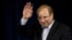 Mohammad Baqer Qalibaf waves after registering his candidacy for the June presidential election.