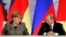 Ангела Меркель і Володимир Путін