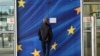 Belgium - A man looks at a sign announcing that a door is closed for security reasons at the European Commission’s Berlaymont building in Brussels, on September 22, 2014. 