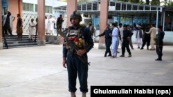 FILE: Afghan security officials secure the hospital after injured victims of the suicide bomb attack at an election campaign in Kama district are brought to a hospital in Jalalabad in October 2018.