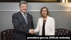Ukrainian President Petro Poroshenko with EU foreign policy chief Federica Mogherini on March 12 in Kyiv.