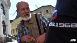 Russian activist Sergei Shavrov-Delaunay just after his release from police custody, where he had been taken after attending a protest on Moscow's Red Square on August 25. 