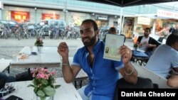 Ahmed Greri, who came to Germany from the Yarmouk Palestinian refugee camp in Syria, said he had been waiting for his identity documents for 17 months while authorities puzzled over his paperwork. He received a refugee travel document in late July. 