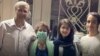 Nasrin Sotoudeh (masked) poses with her husband and children after her release from prison on July 21.
