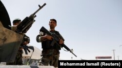 FILE: Afghan National Army (ANA) soldiers keep watch at a checkpoint on the Ghazni Province. 