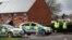 Police officers guard the cordoned-off area around the home of former Russian intelligence officer Sergei Skripal in Salisbury, Britain, on April 3.