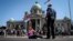 serbia -- Anti-government protestors stand in front of the parliament building ahead of the inaugural parliament session in Belgrade, on August 3, 2020.