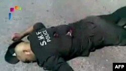 Фото убитого полицейского, показанное государственным сирийским телевидением