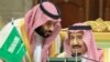 FILE: Saudi Arabia's Crown Prince Mohammed bin Salman talks with Saudi Arabia's King Salman bin Abdulaziz Al Saud during the Gulf Cooperation Council's (GCC) Summit in Riyadh in December 2018.