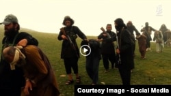 Grab from a video that shows militants loyal to the Islamic State (IS) blowing up bound and blindfolded Afghan prisoners with explosives in the eastern Afghan province of Nangarhar in August 2015.