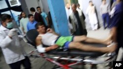 An injured man arrives at a hospital in Kabul following attacks at a sports center in a Shiite neighborhood of of Afghanistan's capital on September 5.