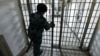 A guard opens a door inside a Russia prison. (illustrative photo)