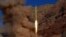 A ballistic missile is launched at an undisclosed location in this handout photo released by Fars news on March 9.