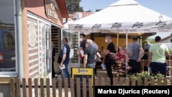 People wait to receive doses of the Chinese Sinopharm COVID-19 vaccine at a restaurant in Kragujevac, Serbia, in March.