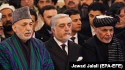 FILE: Afghan President Mohammad Ashraf Ghani (R), Afghan chief executive Abdullah Abdullah (C) and Afghan former president Hamid Karzai (L) during a ceremony in February 2019.