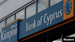 Greece -- Tho logo of the Bank of Cyprus is seen at one of its branches in Athens, 17Mar2013