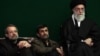 Unlike Iranian President Mahmud Ahmadinejad (center), proposed Iranian election reform could play into the hands of other establishment figures such as parliament speaker Ali Larijani (left) and Supreme Leader Ali Khamenei (right). 