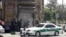 Journalists and police crouch near the Iranian parliament in the capital Tehran during an attack on the complex that left at least a dozen people dead. 