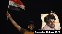 یک هوادار مقتدی صدر در بغداد.