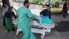 FILE: A wounded victim being carried into a hospital in Kabul on July 25. 